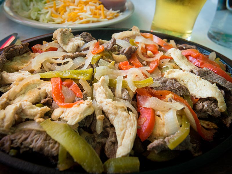 image of chicken and steak fajitas at RC Otter's Eats restaurant | Captiva Island Inn
