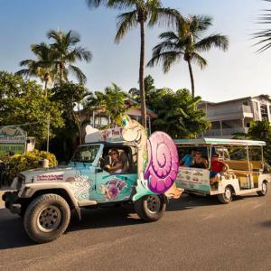 People riding S Car Go Transport near Captiva Island Inn